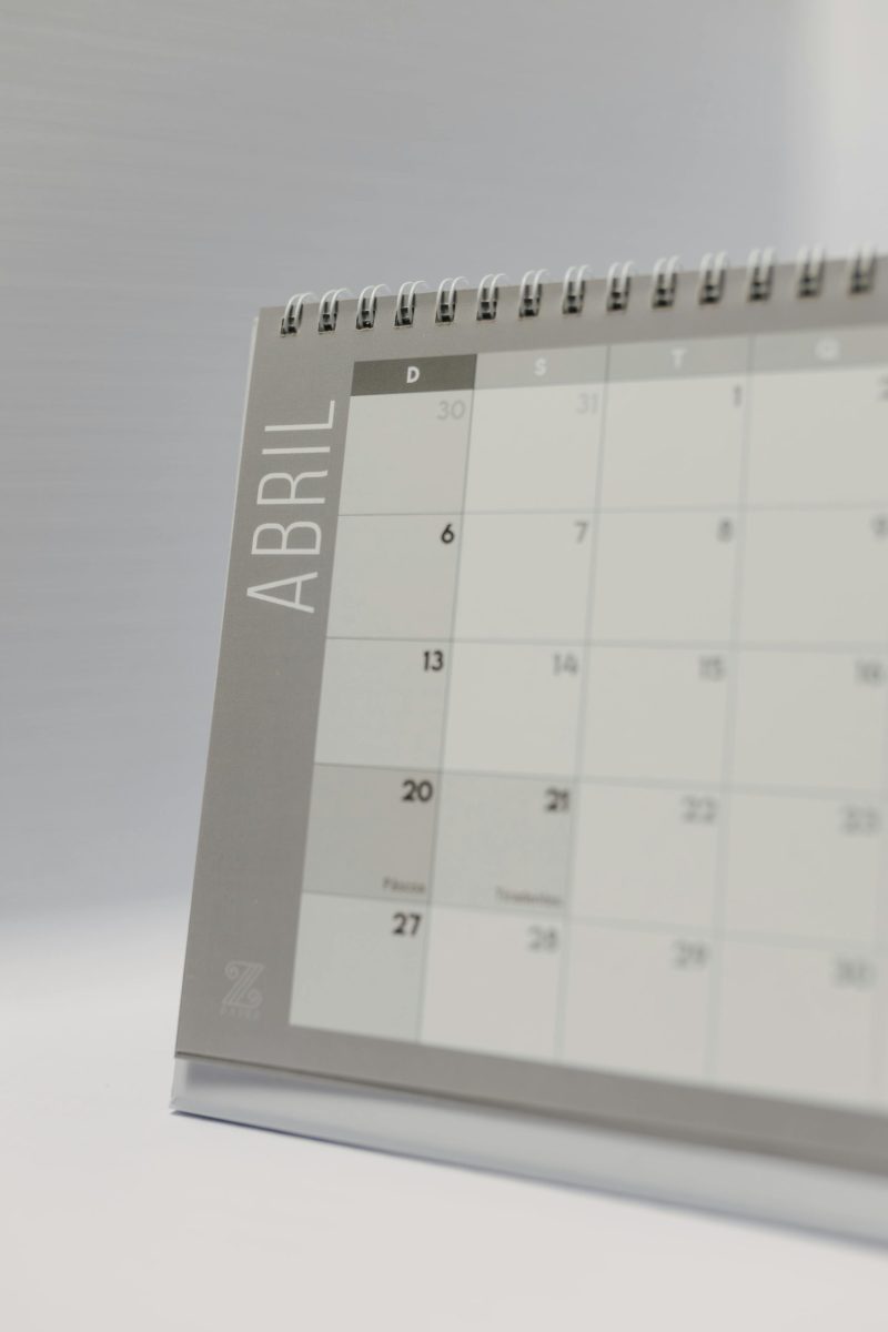 Close-up image of a minimalist desk calendar displaying April dates with a neutral background.